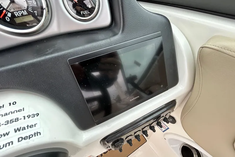 Slide: The Image of Dashboard of 2022 NauticStar 243 DC with Garmin display and gauges. - 16