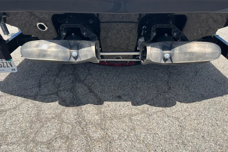 Slide: The Image of Rear view of 2015 Chaparral Vortex 223 VRX jet boat on pavement. - 13