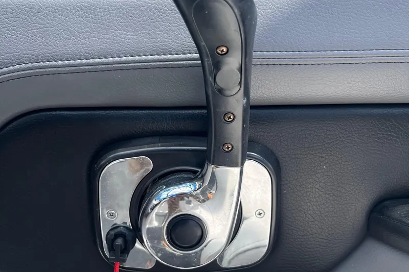 Slide: The Image of Throttle control lever on 2015 Chaparral Vortex 223 VRX boat dashboard. - 17