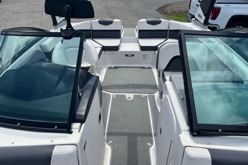 Slide: The Image of 2015 Chaparral Vortex 223 VRX boat interior with seating and windshield. - 6