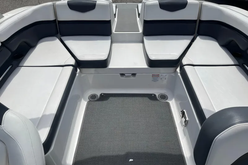 Slide: The Image of 2015 Chaparral Vortex 223 VRX boat interior with white and black seating. - 8