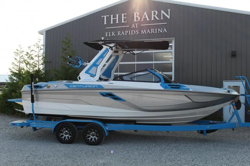 The Image of 2026 Centurion Ri 230 boat on trailer at Elk Rapids Marina. - 1