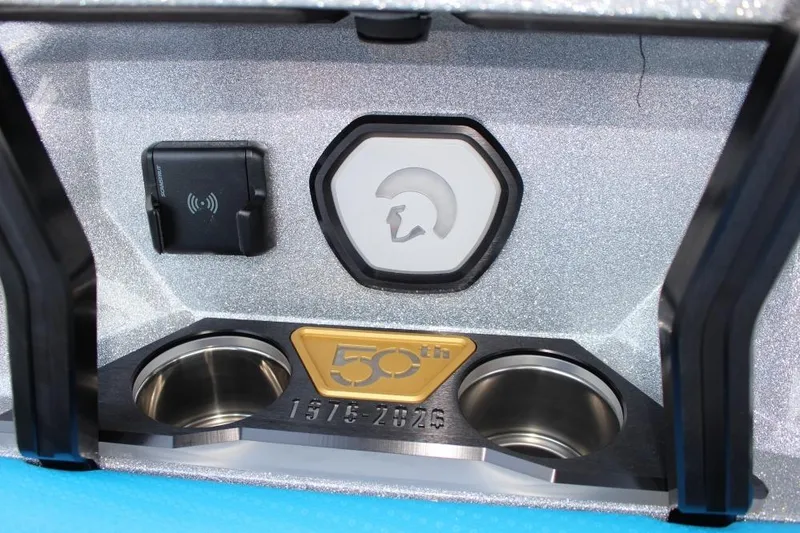 Slide: The Image of Centurion Ri 230 2026 dashboard with 50th anniversary emblem and cup holders. - 11