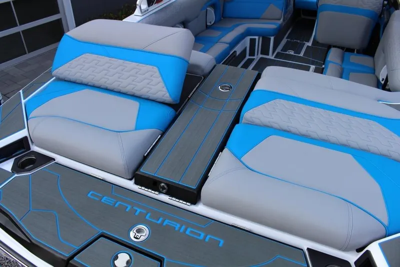 Slide: The Image of 2026 Centurion Ri 230 boat interior with blue and gray seating, modern design. - 4