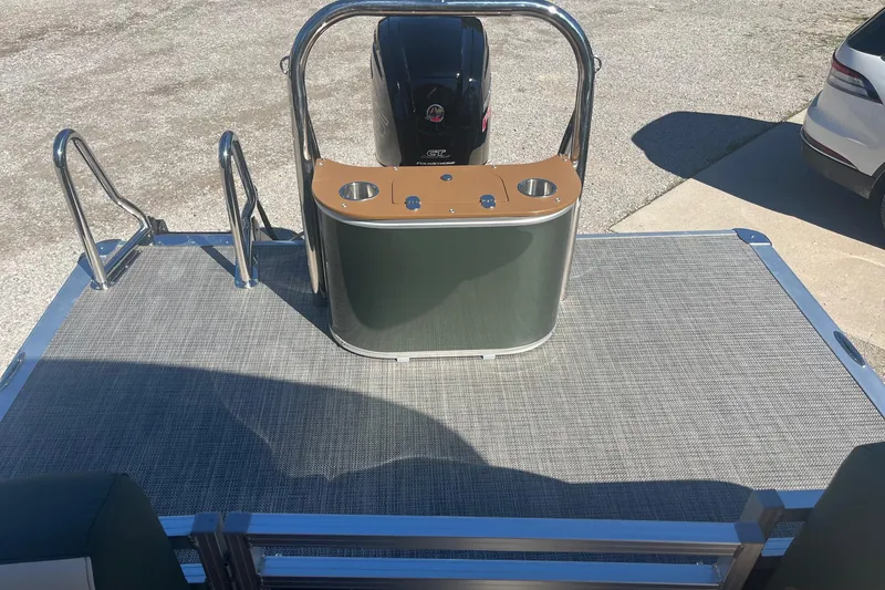 Slide: The Image of 2026 Avalon 23 LSZ Quad Lounger boat deck with motor and railing. - 6