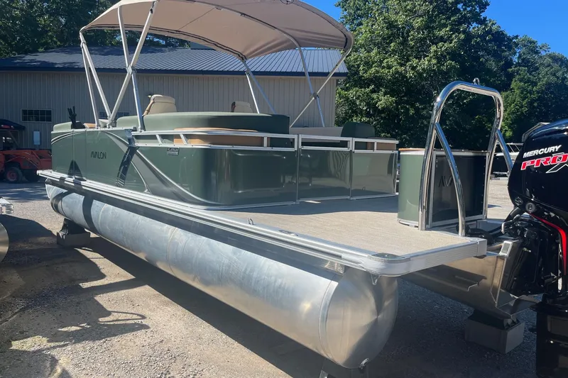 Slide: The Image of 2026 Avalon 23 LSZ Quad Lounger pontoon boat with canopy and Mercury Pro XS engine. - 8