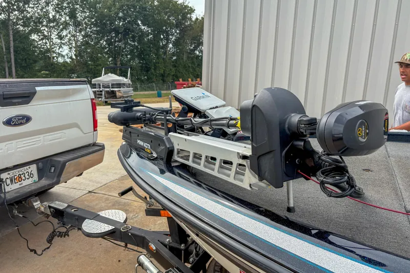 Slide: The Image of 2016 Skeeter ZX200 boat with Minn Kota motor, hitched to a Ford truck. - 12