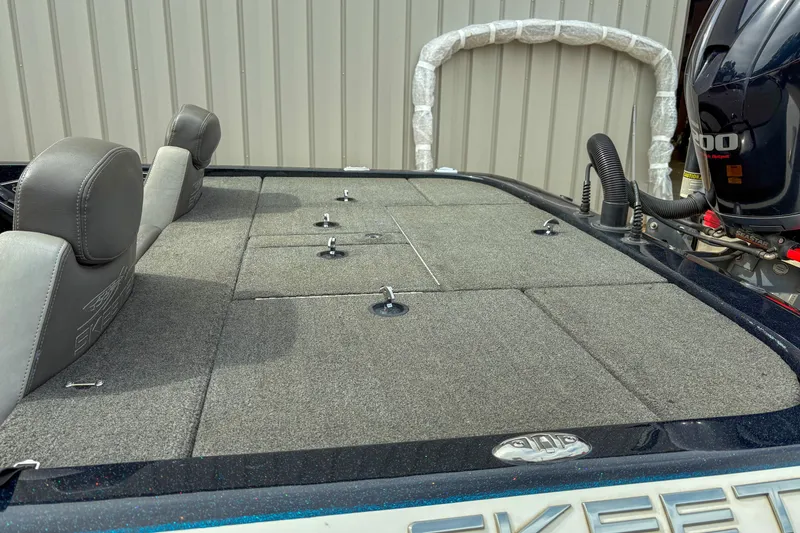 Slide: The Image of 2016 Skeeter ZX200 boat deck with storage compartments and motor. - 3