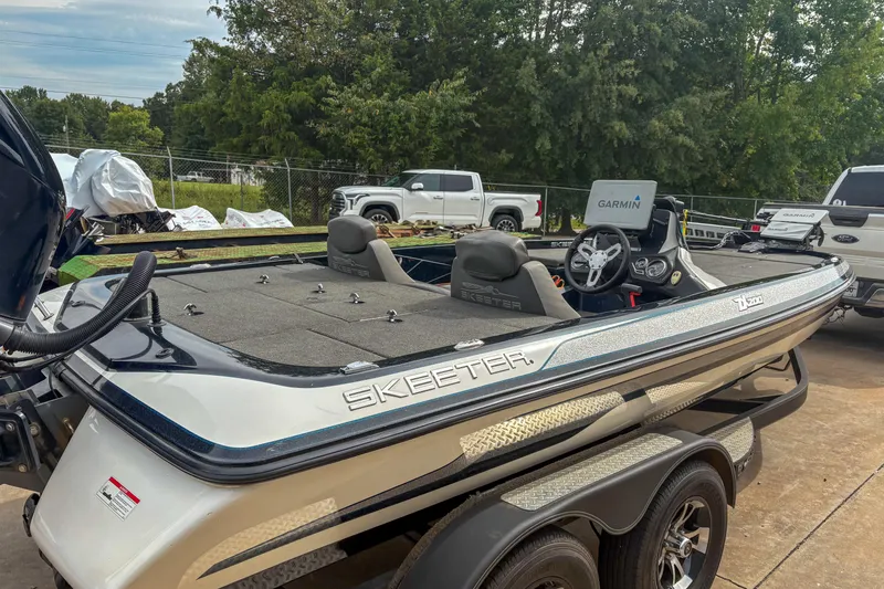 Slide: The Image of 2016 Skeeter ZX200 boat with Garmin electronics, parked outdoors. - 4