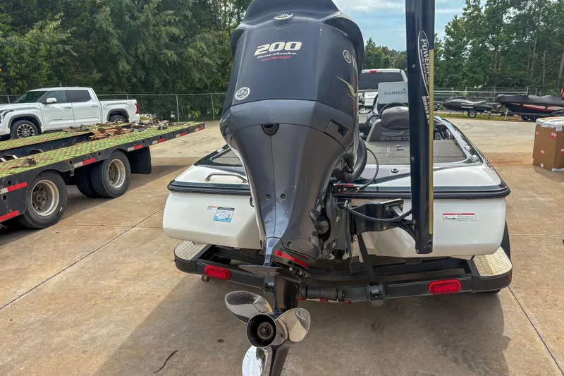 Slide: The Image of 2016 Skeeter ZX200 boat with Yamaha 200 engine, parked on a trailer. - 5