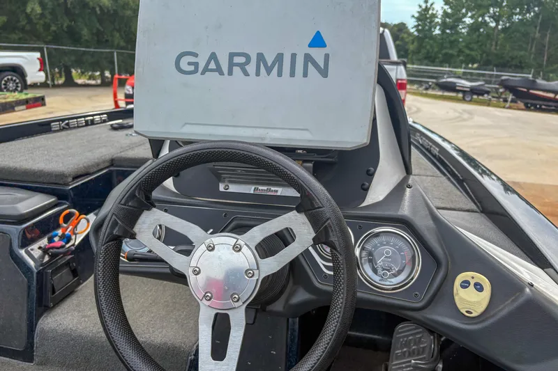 Slide: The Image of 2016 Skeeter ZX200 boat dashboard with Garmin GPS and steering wheel. - 6
