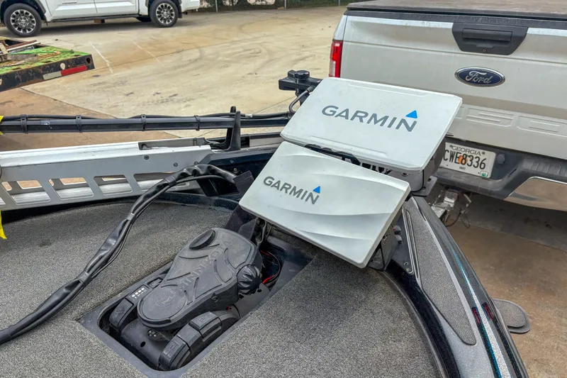 Slide: The Image of 2016 Skeeter ZX200 boat with Garmin navigation system and Ford truck in background. - 8