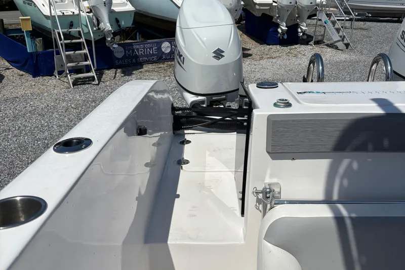 Slide: The Image of 2022 Twin Vee 240 GFX CC boat with Suzuki outboard motor at marine sales. - 11