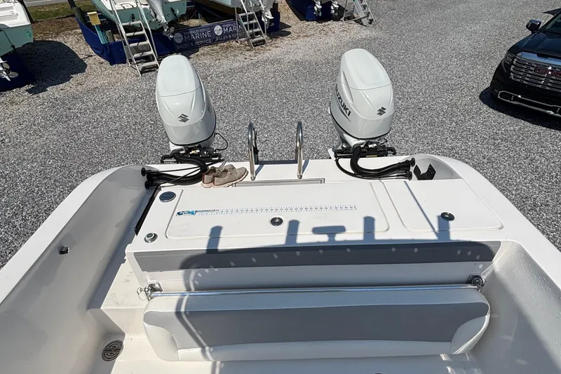 Slide: The Image of 2022 Twin Vee 240 GFX CC boat with dual Suzuki outboard motors. - 12