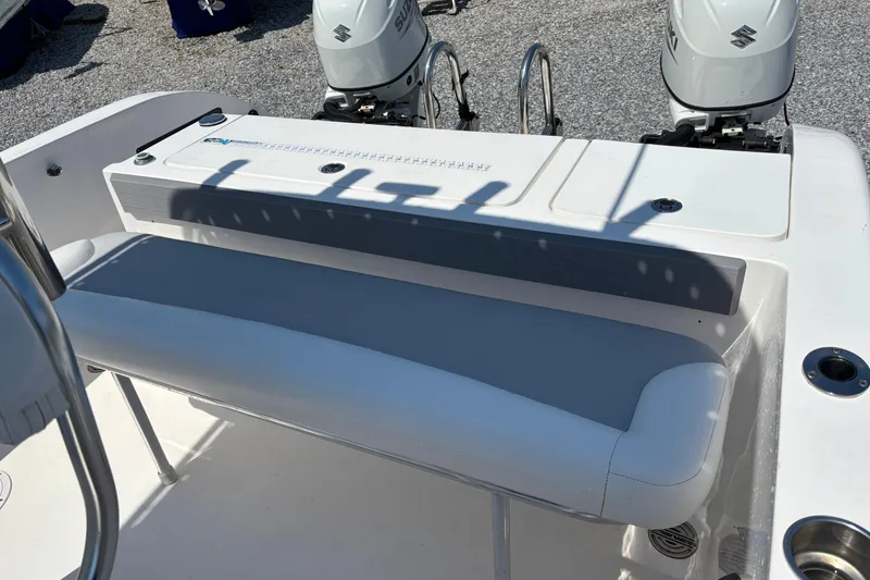 Slide: The Image of 2022 Twin Vee 240 GFX CC boat interior with dual Suzuki outboard motors. - 13