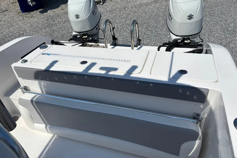 Slide: The Image of 2022 Twin Vee 240 GFX CC boat with dual Suzuki outboard motors. - 14