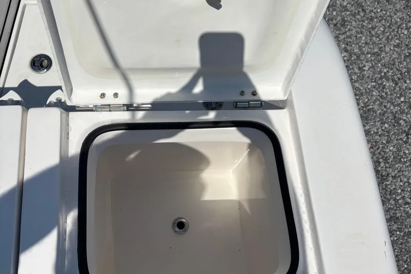 Slide: The Image of Open storage compartment on 2022 Twin Vee 240 GFX CC boat. - 16