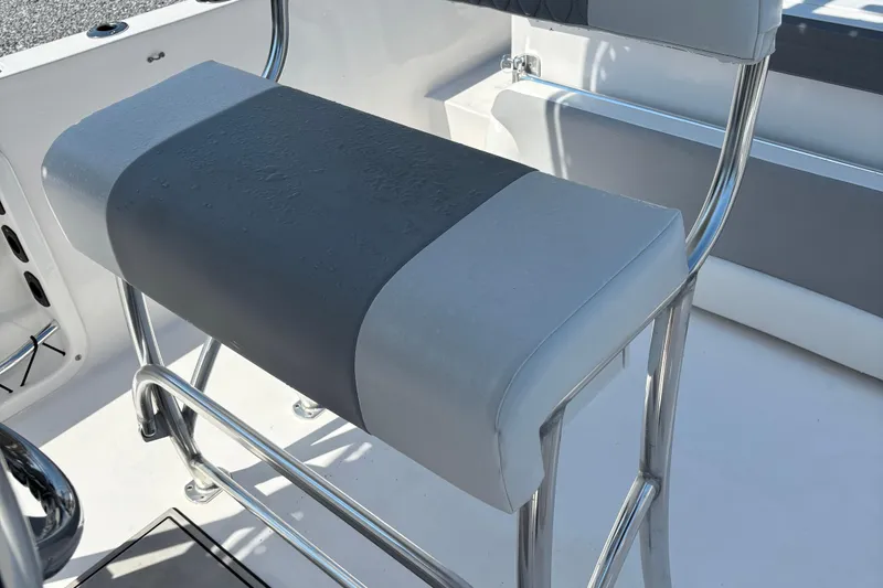 Slide: The Image of 2022 Twin Vee 240 GFX CC boat seat with sleek metal frame and cushioned design. - 17
