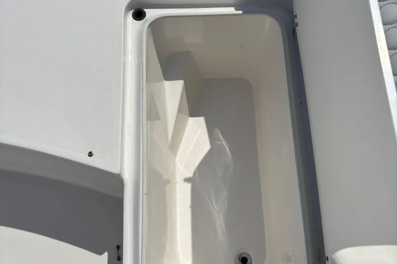 Slide: The Image of 2022 Twin Vee 240 GFX CC boat storage compartment, open and empty. - 24