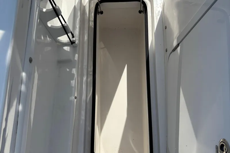Slide: The Image of 2022 Twin Vee 240 GFX CC boat storage compartment, open and empty. - 33