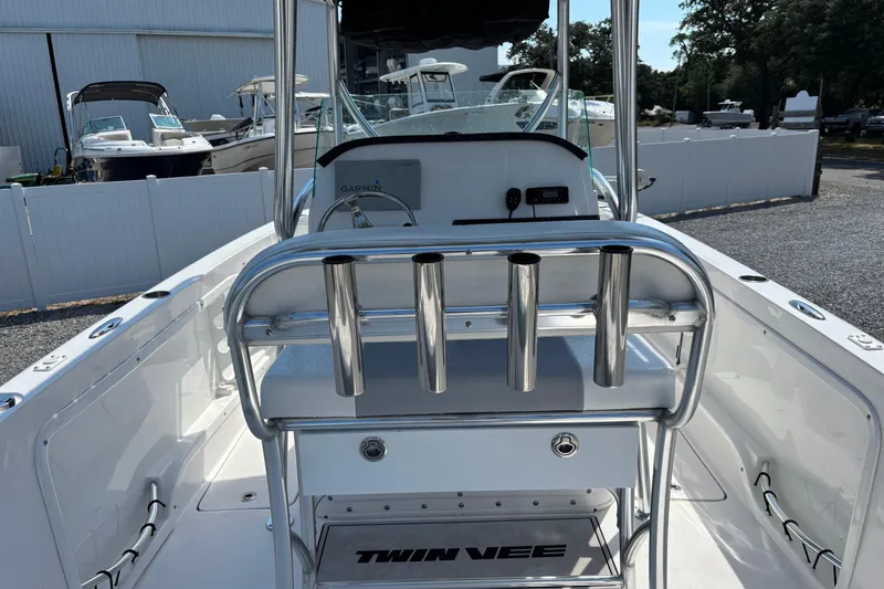 Slide: The Image of 2022 Twin Vee 240 GFX CC boat interior with rod holders and console. - 35