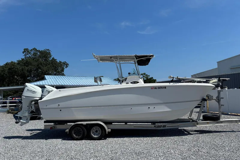 Slide: The Image of 2022 Twin Vee 240 GFX CC boat on trailer with dual Suzuki engines. - 5