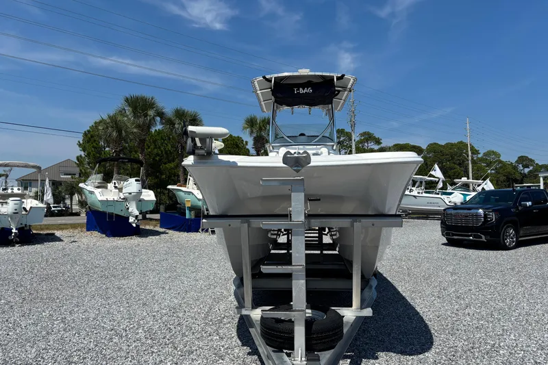 Slide: The Image of 2022 Twin Vee 240 GFX CC boat on trailer in outdoor showroom. - 7