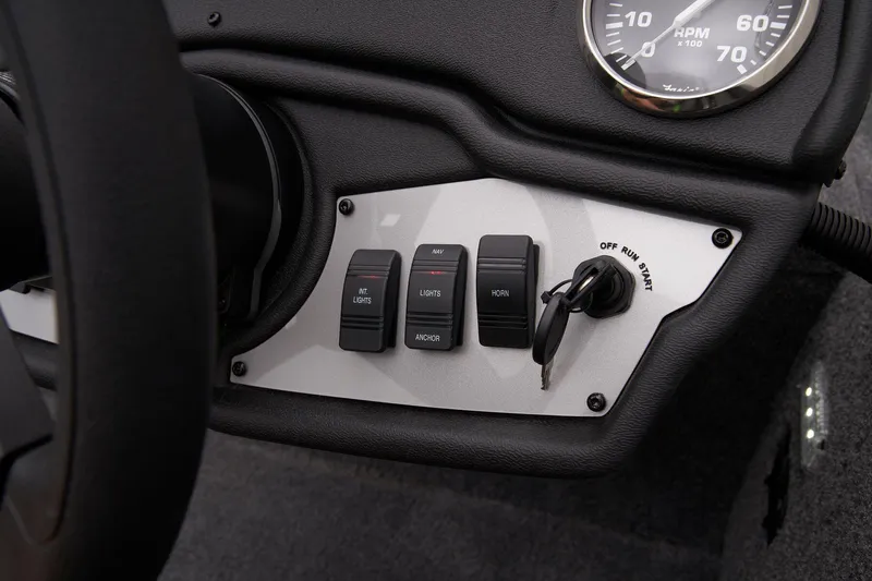 Slide: The Image of Manufacturer Provided Image: Control panel of 2025 Ranger RT178 boat with switches and ignition key. - 44