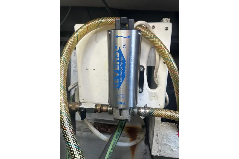 Slide: The Image of Reverso oil change system in 1998 Mainship Pilot 30 boat engine compartment. - 13