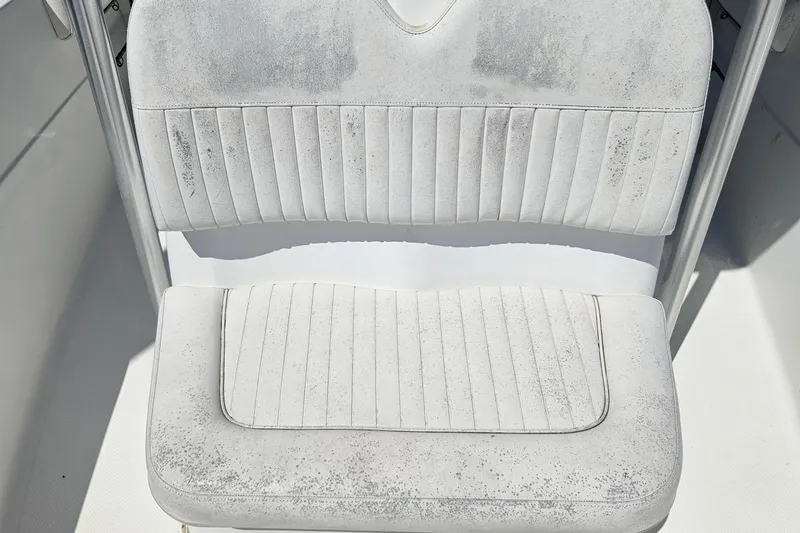 Slide: The Image of Worn white seat on 2012 Sea Fox 226CC boat, showing signs of use. - 5