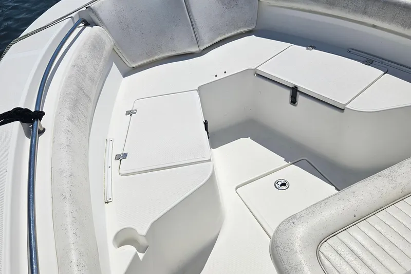 Slide: The Image of 2012 Sea Fox 226CC boat interior with storage compartments and cushioned seating. - 6