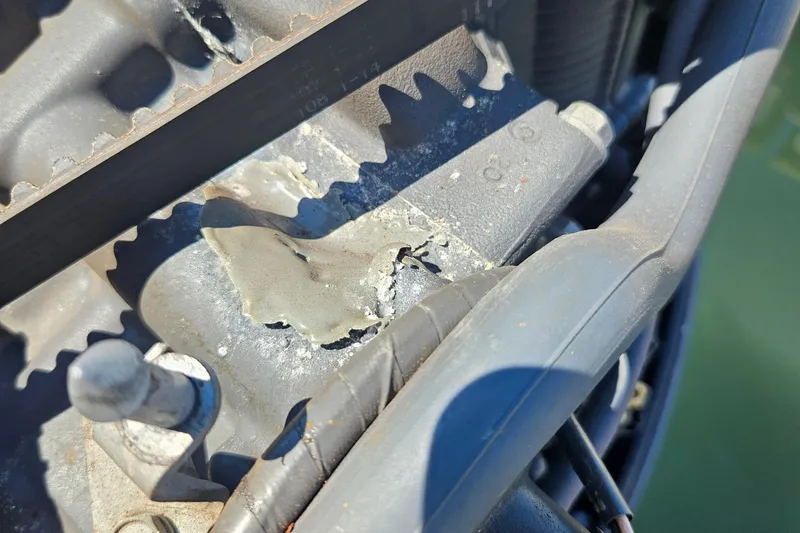 Slide: The Image of Close-up of a damaged engine component on a 2012 Sea Fox 226CC boat. - 7