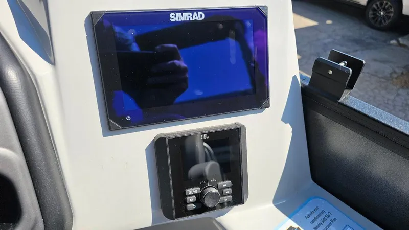 Slide: The Image of 2025 Bentley Pontoons Legacy 243 Swingback seating with cup holders and speakers. - 10