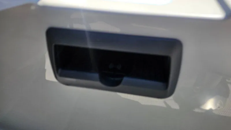 Slide: The Image of 2025 Bentley Pontoons Legacy 243 Swingback with luxurious gray seating and cup holders. - 11