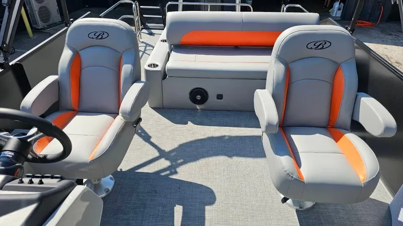 Slide: The Image of 2025 Bentley Pontoons Legacy 243 Swingback with luxurious gray seating and cup holders. - 14