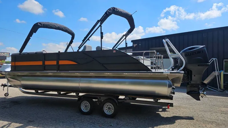 Slide: The Image of 2025 Bentley Pontoons Legacy 243 Swingback with powerful 200 HP engine, outdoor setting. - 4