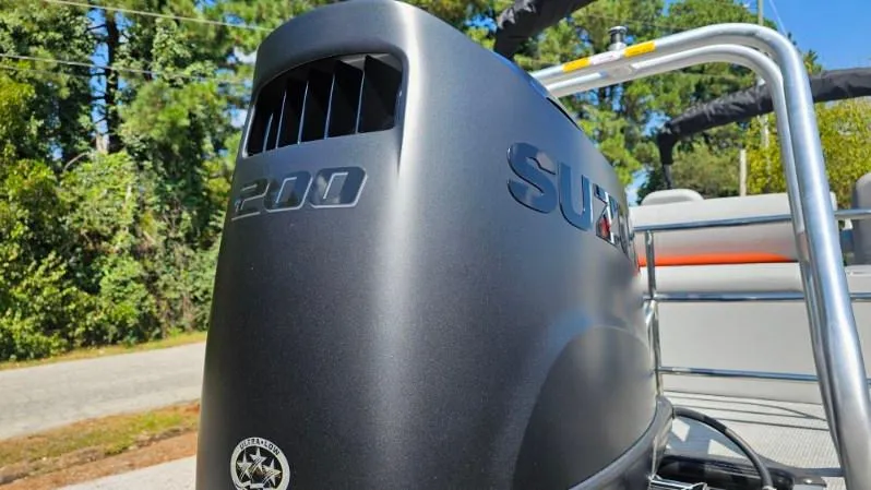 Slide: The Image of Captain's chair and helm of 2025 Bentley Pontoons Legacy 243 Swingback, featuring modern controls. - 6