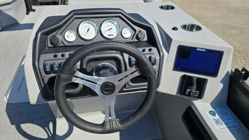 Slide: The Image of Control panel and storage compartment on 2025 Bentley Pontoons Legacy 243 Swingback. - 9