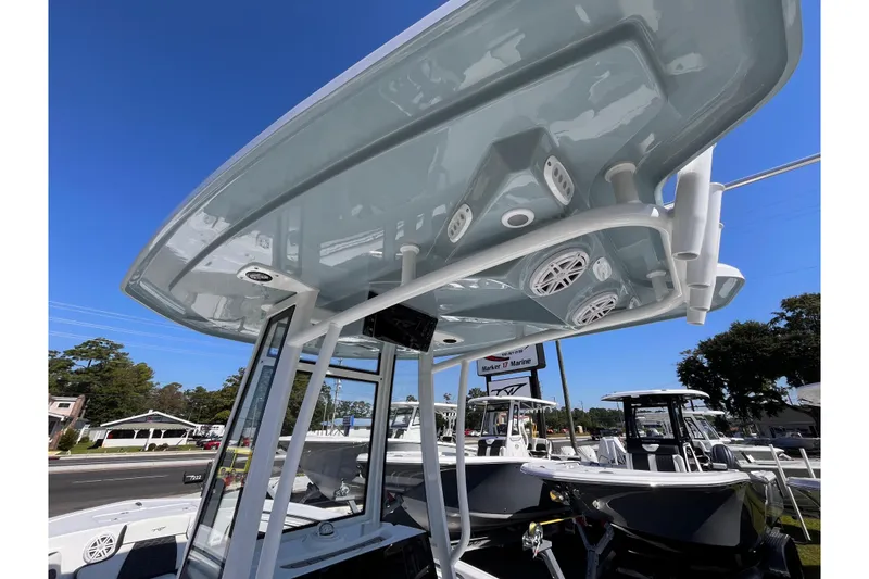 Slide: The Image of 2026 Tidewater 220 LXF boat with sleek T-top and integrated speakers. - 15
