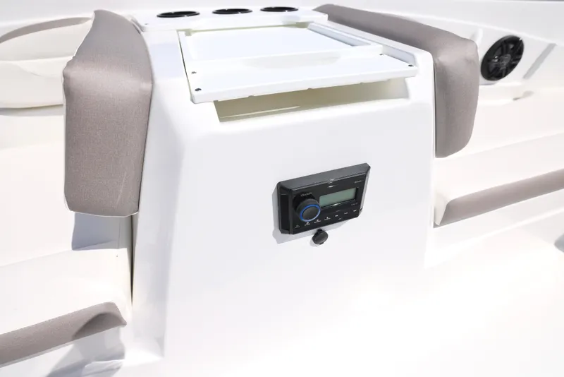 Slide: The Image of 2025 Hurricane SunDeck Sport 205 OB boat docked on calm water. - 18