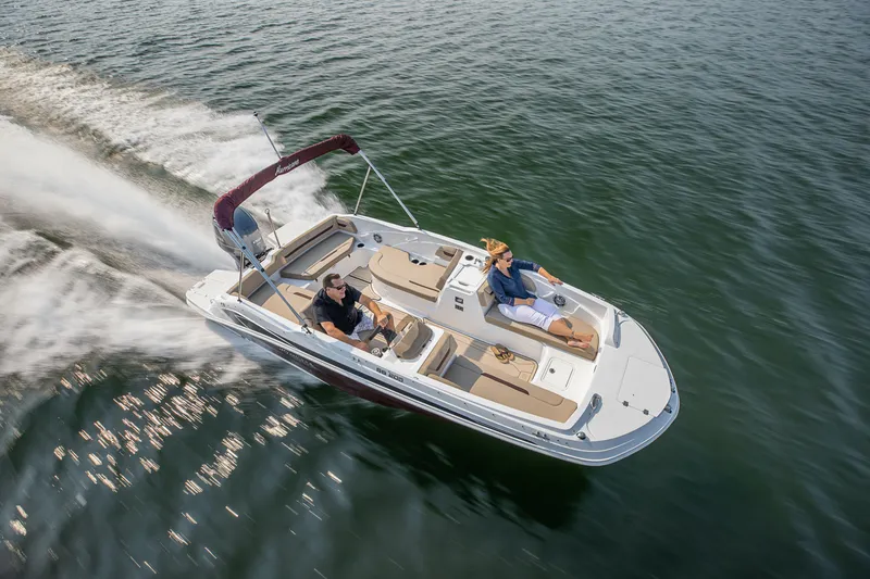 Slide: The Image of Woman enjoying 2025 Hurricane SunDeck Sport 205 OB boat on a sunny day. - 23