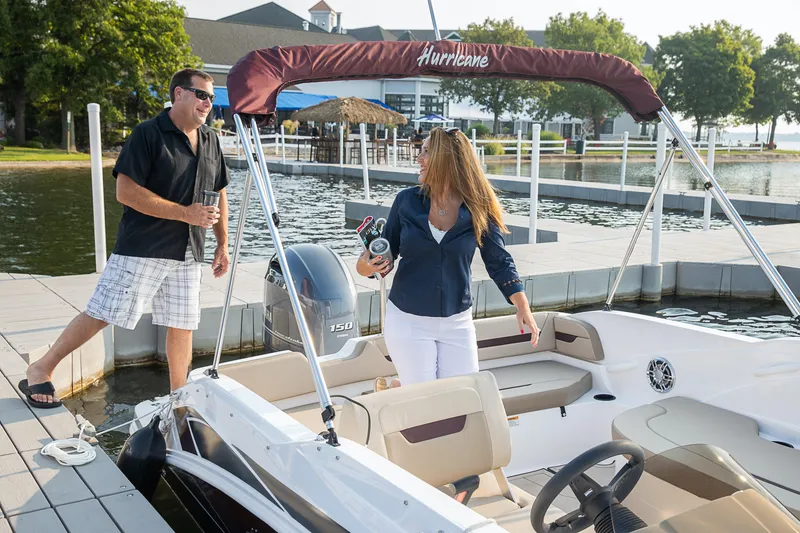 Slide: The Image of Aerial view of 2025 Hurricane SunDeck Sport 205 OB boat on water. - 26