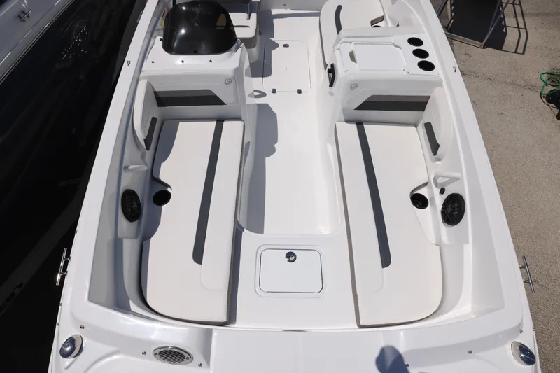 Slide: The Image of 2026 Hurricane SunDeck Sport 205 OB boat, white interior, parked outdoors, showcasing spacious seating. - 3