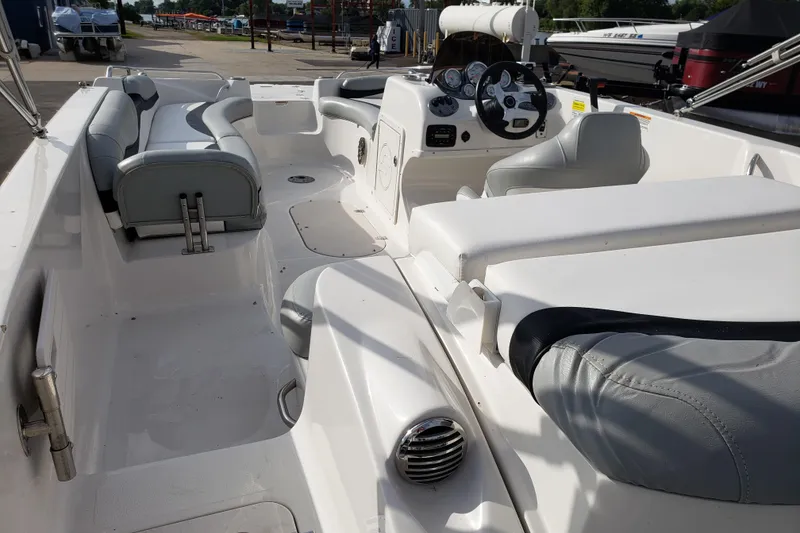 Slide: The Image of 2015 Starcraft Limited 2000 IO boat interior with seating and steering console. - 11