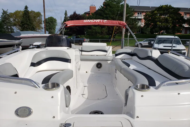Slide: The Image of 2015 Starcraft Limited 2000 IO boat with spacious seating and modern design. - 12