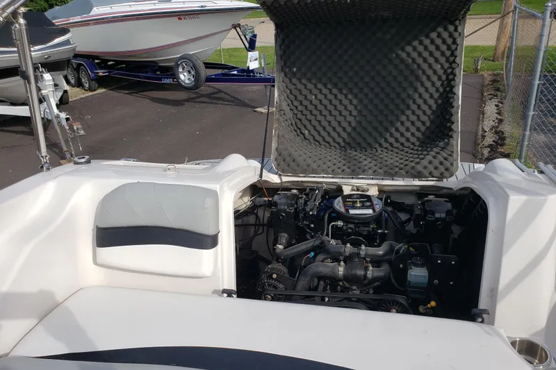 Slide: The Image of Open engine compartment of 2015 Starcraft Limited 2000 IO boat, showcasing interior components. - 14