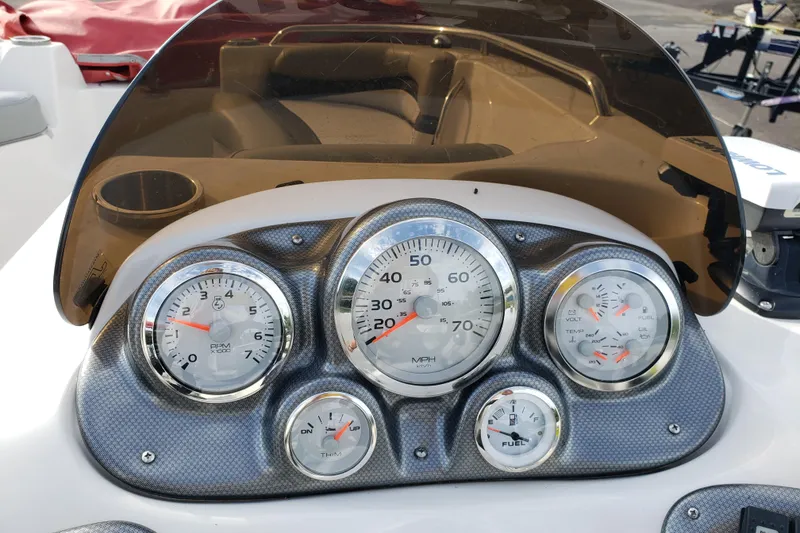 Slide: The Image of Dashboard of a 2015 Starcraft Limited 2000 IO boat with gauges and controls. - 6