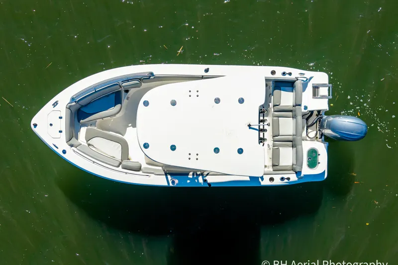 Slide: The Image of 2021 NauticStar 2102 Legacy boat, aerial view on green water. - 7