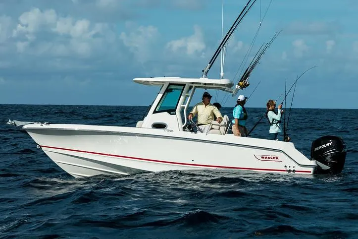 Slide: The Image of Manufacturer Provided Image: 2017 Boston Whaler 250 Outrage boat on the ocean with people fishing. - 2