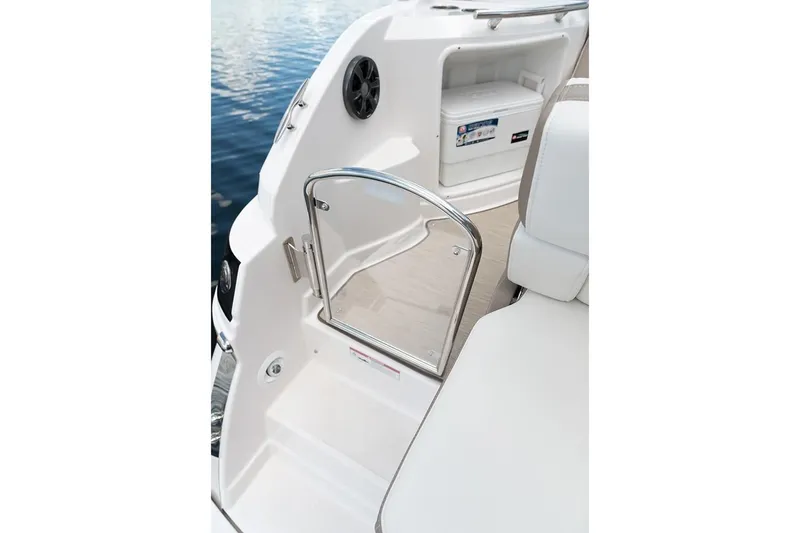 Slide: The Image of 2019 Regal 28 Express boat interior with open door and storage compartment. - 9